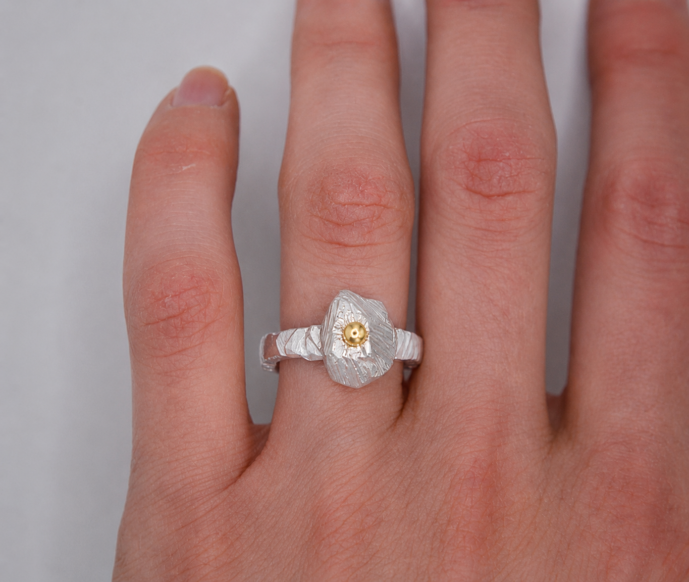 Mixed metal rock ring