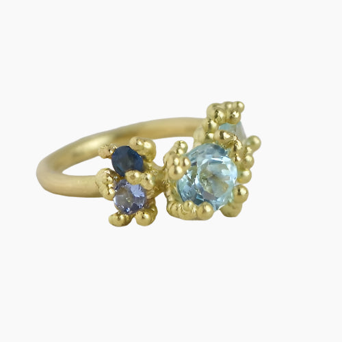 multistone gold ring with beaded detail