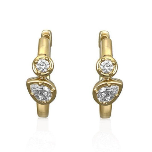 mixed diamond huggie earrings set in yellow gold 