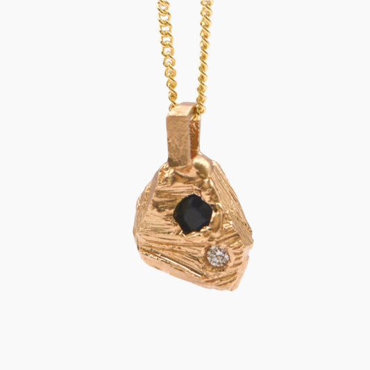 solid gold textured rok pendant featuring precious stones