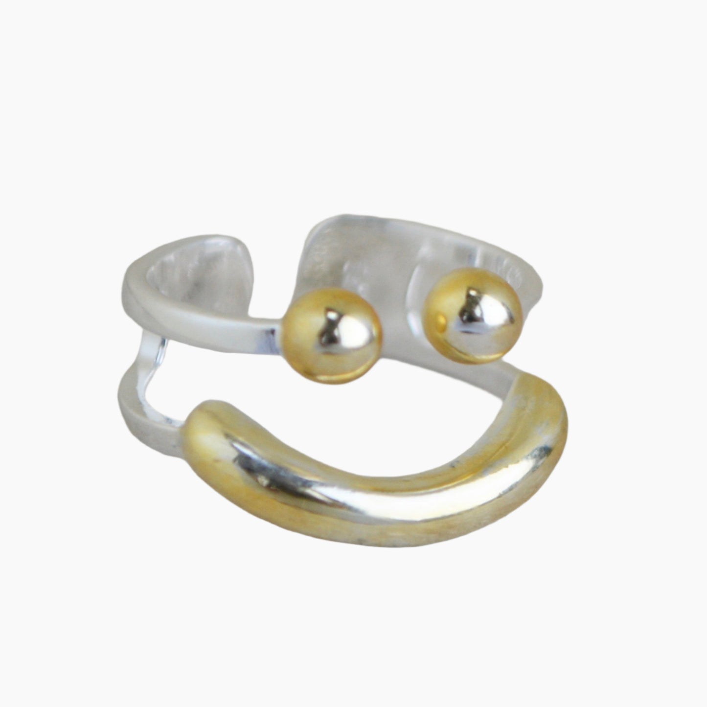 Sterling Silver and 14ct yellow gold face ring. Crafted with care to add a playful touch to any look.