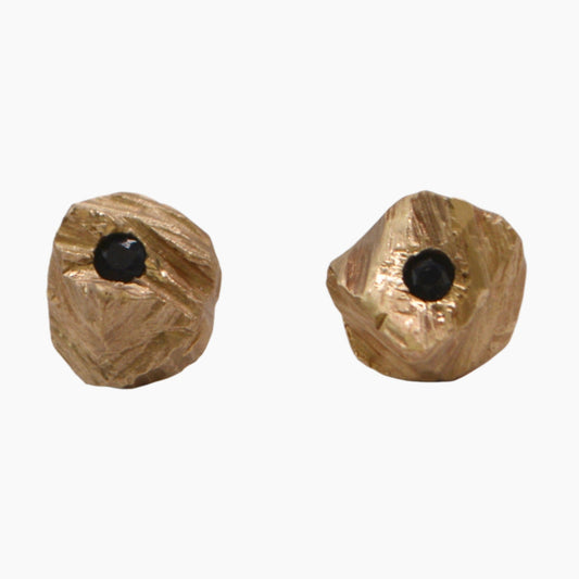 gold rock studs featuring sapphires
